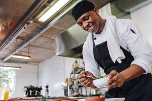 young chef preparing meals in kitchen